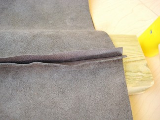 hammering a leather seam